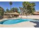 Sparkling community pool with spa, lounge chairs, and covered seating area for residents at 2708 Campo Verde Dr, Las Vegas, NV 89121