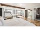 Open bedroom with hardwood floors featuring a bunk bed and queen bed, with exposed beam at 2890 Belcastro St, Las Vegas, NV 89117