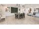 Bright dining area features art adorned walls, accent lighting, and tiled floors at 2890 Belcastro St, Las Vegas, NV 89117