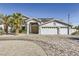 Charming two-story home with a three-car garage, circular driveway, and manicured landscaping at 2890 Belcastro St, Las Vegas, NV 89117