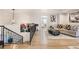 Open living area on the second floor boasts hardwood floors and an ornate railing overlooking the stairs at 2890 Belcastro St, Las Vegas, NV 89117