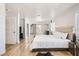 Spacious main bedroom boasts light hardwood floors and ample light, with direct access to outdoor deck at 2890 Belcastro St, Las Vegas, NV 89117