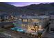 Stunning aerial view of the backyard, pool, and mountain range in the background at 2890 Reverence Heights Ln, Las Vegas, NV 89138