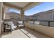 Balcony with comfortable seating and scenic mountain views, perfect for outdoor relaxation at 2890 Reverence Heights Ln, Las Vegas, NV 89138