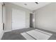 Neutral bedroom featuring sliding closet doors and carpeted floors at 2890 Reverence Heights Ln, Las Vegas, NV 89138