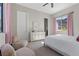 Cozy bedroom with a mountain view, soft chairs, and light-colored walls at 2890 Reverence Heights Ln, Las Vegas, NV 89138