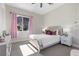Bright bedroom with a decorative headboard, plush pillows, and a scenic mountain view from the window at 2890 Reverence Heights Ln, Las Vegas, NV 89138