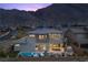 Beautiful home with a pool and mountain views, complemented by an outdoor kitchen and spiral staircase at 2890 Reverence Heights Ln, Las Vegas, NV 89138