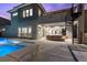 Luxury home with a pool, spa, and outdoor kitchen, showcasing a modern design and upscale amenities at 2890 Reverence Heights Ln, Las Vegas, NV 89138