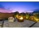 Relaxing outdoor fire pit area with comfortable seating, perfect for cozy evenings and gatherings at 2890 Reverence Heights Ln, Las Vegas, NV 89138