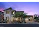 Charming two-story home with professionally landscaped front yard and covered garage at 2890 Reverence Heights Ln, Las Vegas, NV 89138