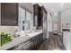 Bright, modern kitchen with stainless steel appliances, and a view of the living area at 2890 Reverence Heights Ln, Las Vegas, NV 89138