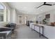 Bright living area with contemporary décor, neutral color palette, and scenic outdoor views at 2890 Reverence Heights Ln, Las Vegas, NV 89138