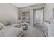 Comfortable living room with modern furniture and a sliding glass door to the outside at 2890 Reverence Heights Ln, Las Vegas, NV 89138