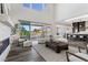 Bright living room featuring access to a patio and an open kitchen area at 2890 Reverence Heights Ln, Las Vegas, NV 89138
