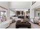 Bright living room with modern decor, and an open concept kitchen with stainless steel appliances at 2890 Reverence Heights Ln, Las Vegas, NV 89138