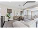 Bright living room boasts a modern aesthetic, neutral tones, and an open layout at 2890 Reverence Heights Ln, Las Vegas, NV 89138