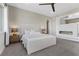 Bright main bedroom features a ceiling fan, bedside tables, and neutral decor at 2890 Reverence Heights Ln, Las Vegas, NV 89138