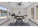 Bright home office featuring modern decor, comfortable seating, and ample natural light from large windows at 2890 Reverence Heights Ln, Las Vegas, NV 89138