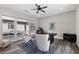 Well-lit home office with modern furnishings, large windows, and stylish decor, creating an inspiring workspace at 2890 Reverence Heights Ln, Las Vegas, NV 89138
