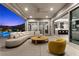 Covered outdoor patio with modern furnishings, a view of the pool, and seamless indoor-outdoor living at 2890 Reverence Heights Ln, Las Vegas, NV 89138
