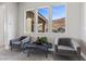 Cozy seating area with comfortable chairs and large windows showcasing mountain views at 2890 Reverence Heights Ln, Las Vegas, NV 89138
