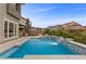 Modern swimming pool with mountain views, spa and waterfall feature at 2890 Reverence Heights Ln, Las Vegas, NV 89138