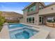 Contemporary backyard featuring a pool, spa, and landscaped yard at 2890 Reverence Heights Ln, Las Vegas, NV 89138