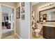 Bathroom featuring a toilet, decorative floral shower curtain, and dark wood cabinets with granite countertop at 2958 Lapis Beach Dr, Las Vegas, NV 89117