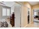 Cozy bedroom with plantation shutters and dark wood dresser, accessible via an open white paneled door at 2958 Lapis Beach Dr, Las Vegas, NV 89117