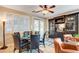 Dining area with large windows, stylish chairs, and dark wood furniture at 2958 Lapis Beach Dr, Las Vegas, NV 89117