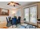 Well-lit dining room with views of the outdoor pool area and access to the backyard at 2958 Lapis Beach Dr, Las Vegas, NV 89117