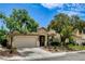 Attractive home featuring a two-car garage and welcoming front porch at 2958 Lapis Beach Dr, Las Vegas, NV 89117