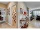 Inviting hallway featuring tile flooring, stylish decor, and access to a full bathroom with shower at 2958 Lapis Beach Dr, Las Vegas, NV 89117