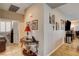 Hallway with decorative artwork leading to a bedroom and dining area at 2958 Lapis Beach Dr, Las Vegas, NV 89117