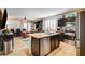 Open-concept kitchen with island, connecting to the dining and living areas at 2958 Lapis Beach Dr, Las Vegas, NV 89117