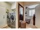 Laundry room with a front-loading washer and dryer, conveniently located near the bedroom at 2958 Lapis Beach Dr, Las Vegas, NV 89117