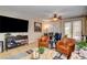 Inviting living room with tile floors, slider doors, and comfortable seating arrangement at 2958 Lapis Beach Dr, Las Vegas, NV 89117