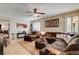 Spacious living room with tile flooring, plantation shutters, and a comfortable sectional sofa at 2958 Lapis Beach Dr, Las Vegas, NV 89117