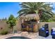 Outdoor tiki bar next to pool provides relaxing space with island vibe seating at 2958 Lapis Beach Dr, Las Vegas, NV 89117