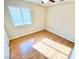 Sunlit bedroom with hardwood floors and ample natural light from a window at 3372 Wayward Ct, Las Vegas, NV 89129
