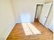 Sunlit bedroom featuring hardwood floors, neutral walls, and an open doorway at 3372 Wayward Ct, Las Vegas, NV 89129
