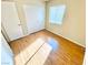 Bright bedroom with hardwood floors, a large window, and a spacious closet at 3372 Wayward Ct, Las Vegas, NV 89129