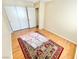 Bedroom featuring hardwood floors, a ceiling fan, closet, and a colorful rug, offering a comfortable space at 3372 Wayward Ct, Las Vegas, NV 89129