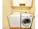 Functional laundry room with modern washer and dryer, plus storage shelving for convenience at 3372 Wayward Ct, Las Vegas, NV 89129