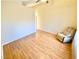 Bright living room featuring hardwood floors, vaulted ceilings, and a cozy armchair at 3372 Wayward Ct, Las Vegas, NV 89129
