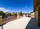 Large, open-air balcony with wrought iron railings, perfect for outdoor dining and relaxation at 3412 Catherine Mermet Ave, North Las Vegas, NV 89081