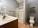 Bathroom featuring a double vanity, shower over bath, and a neutral color palette at 3412 Catherine Mermet Ave, North Las Vegas, NV 89081