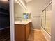 Well-lit bathroom with dual sinks, large mirrors and a shower over bath at 3412 Catherine Mermet Ave, North Las Vegas, NV 89081