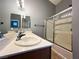 Bathroom with a shower over bath, dual sinks, and a neutral decor at 3412 Catherine Mermet Ave, North Las Vegas, NV 89081